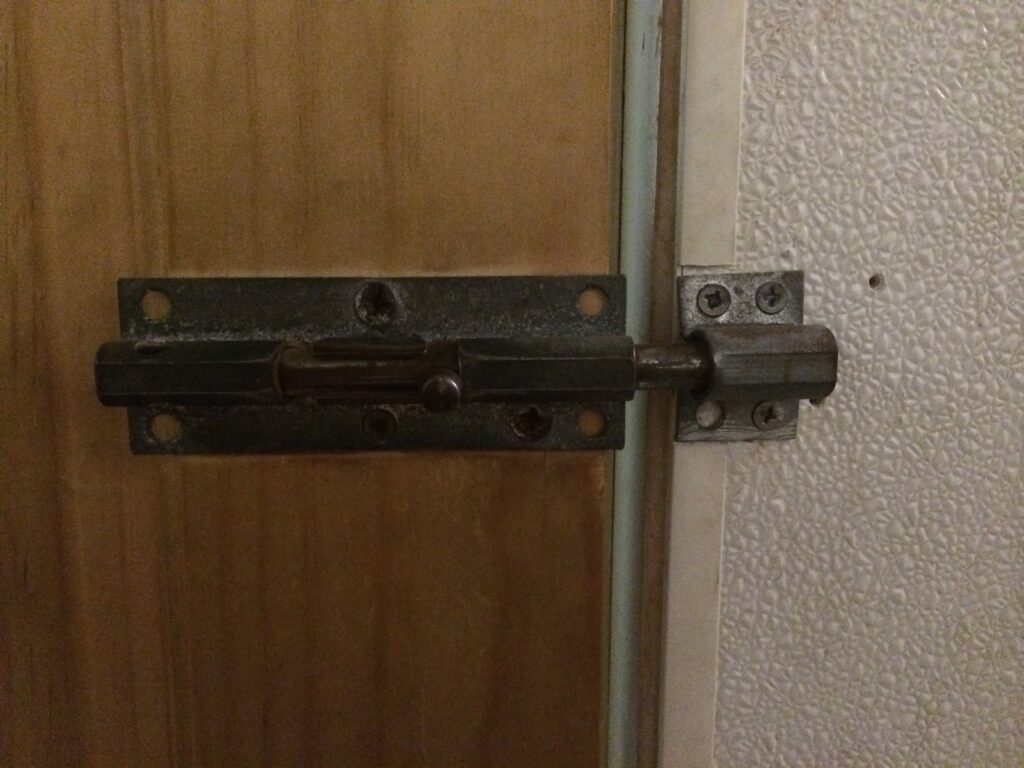 Metal barrel bolt restroom lock