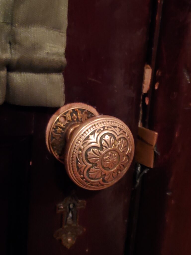 Ornate Knob on Old Wood - Richard H. Driehaus Museum in Chicago