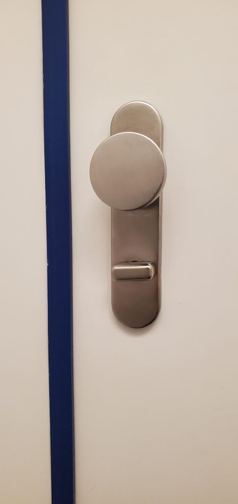 Minimal Deadbolt Lock and Simple Knob - Amsterdam International Airport closeup