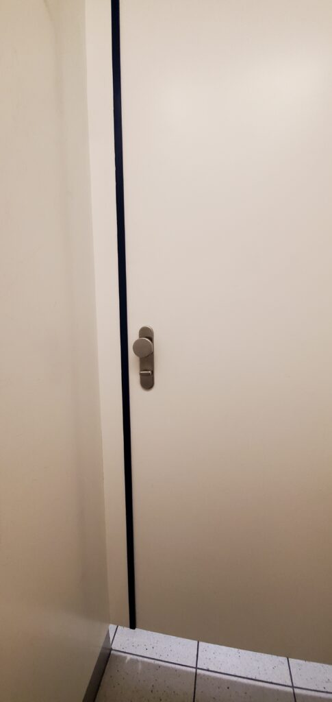 Minimal Deadbolt Lock and Simple Knob - Amsterdam International Airport wide shot