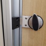 Twisting Flat Bolt Latch on Wood & Metal - Heathrow Airport in London